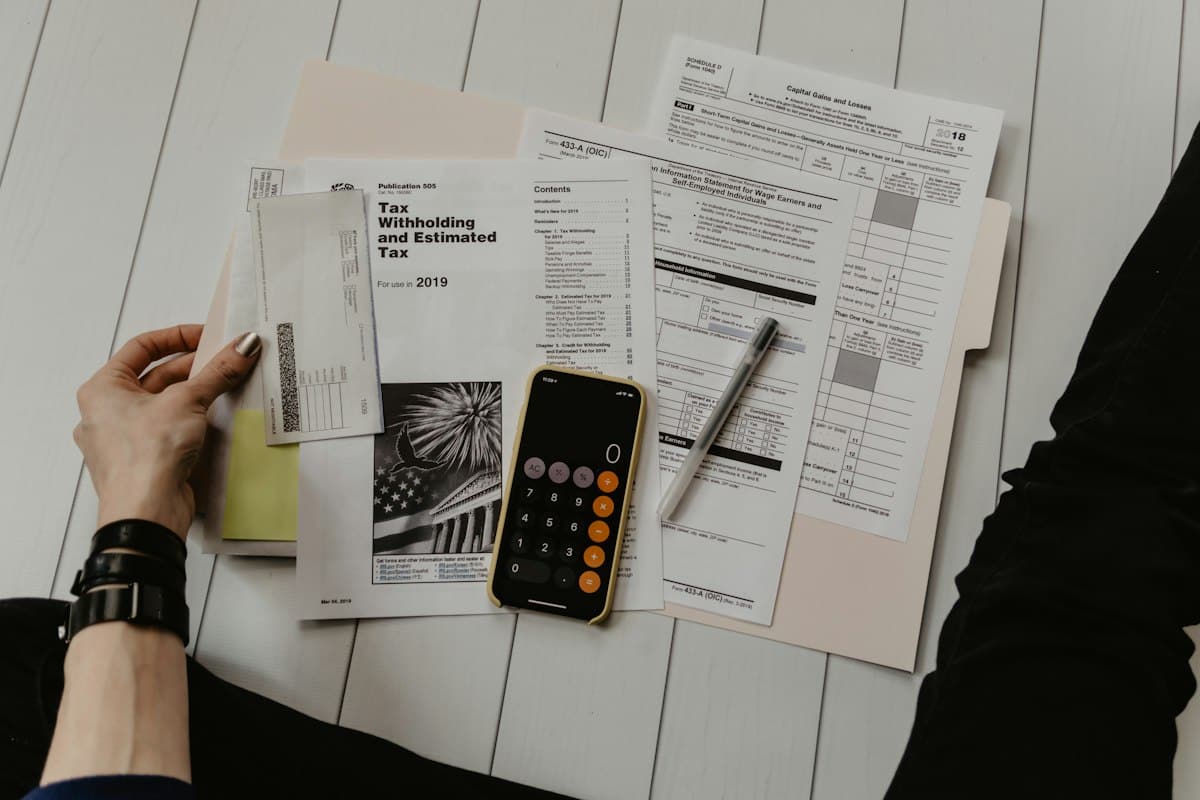 Calculator and paperwork – working out how to use the CGT annual allowance