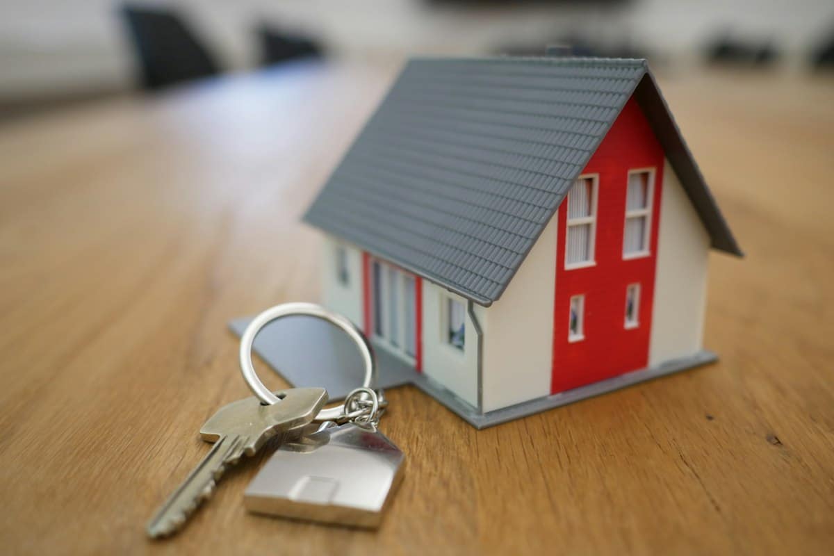 Model house on a desk – capital gains tax planning for property investors