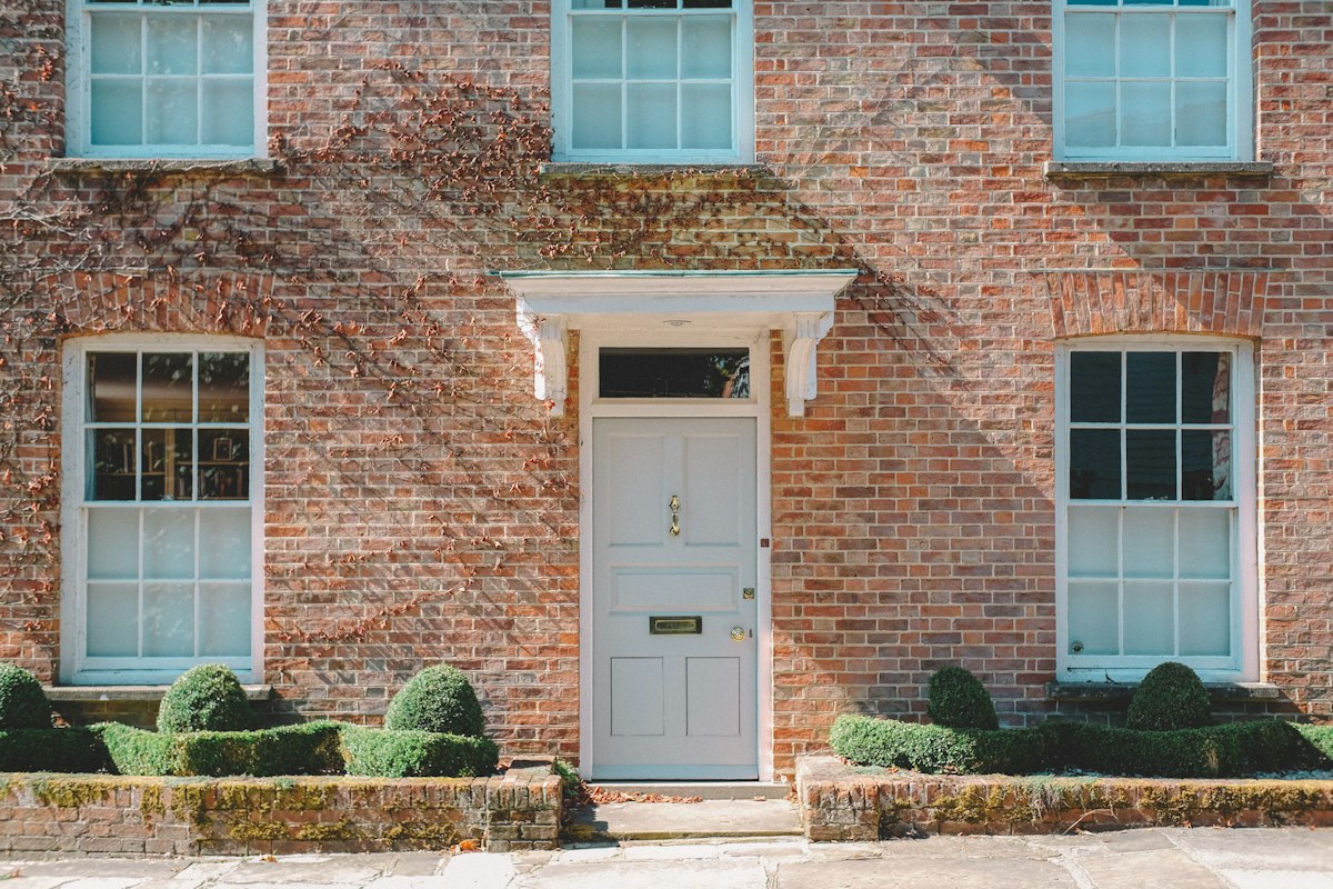 Brick family home with white door – CGT on a property inherited from a parent